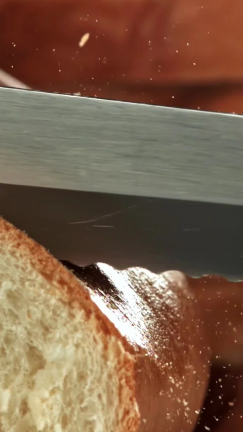 The chef slices fresh bread. Filmed on a high-speed camera at 1000 fps Stock Footage 335367534