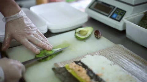 The chef slices the knife avocado Stock Footage 59698904