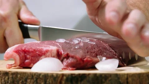 Chef slices meat Stock Footage 221145738