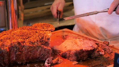 Chef slices prime rib in buffet line Stock Footage 94235460