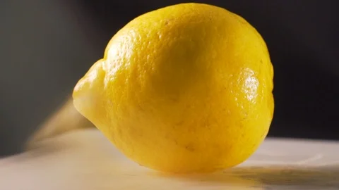 Chef slices ripe lemon Stock Footage 116688225
