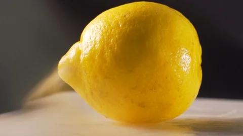Chef slices ripe lemon Stock Footage 116689550