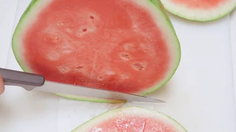 Chef Slices Watermelon on a Cutting Board Stock Footage 79046337