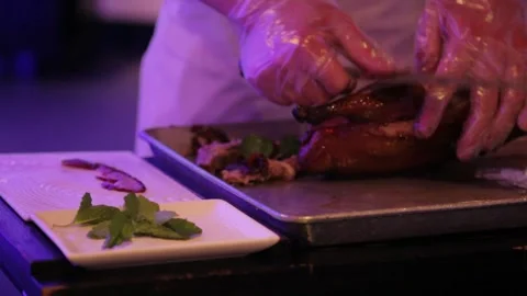 Chef Slicing and Plating Roasted Poultry in Beijing Restaurant Kitchen Stock Footage 345744322