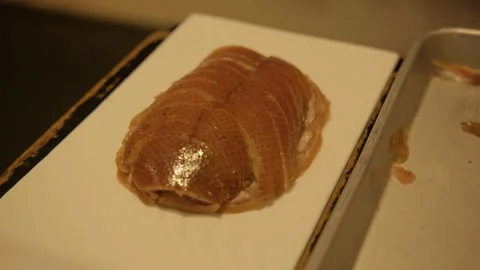 Chef Slicing and Plating Roasted Meat with Garnish in Beijing Restaurant Kitchen Stock Footage 345765903