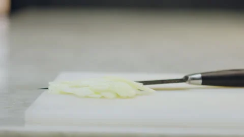 Chef slicing an apple on a chopping board. Stock Footage 321384982