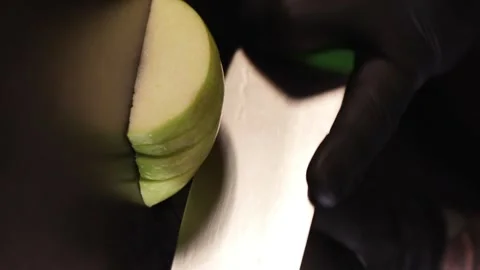 Chef Slicing an Apple - Vertical Video Stock Footage 247138324