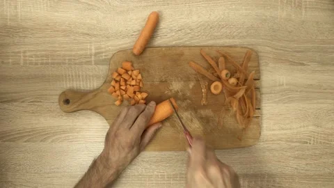 Chef slicing carrot into circles Stock Footage 122280932