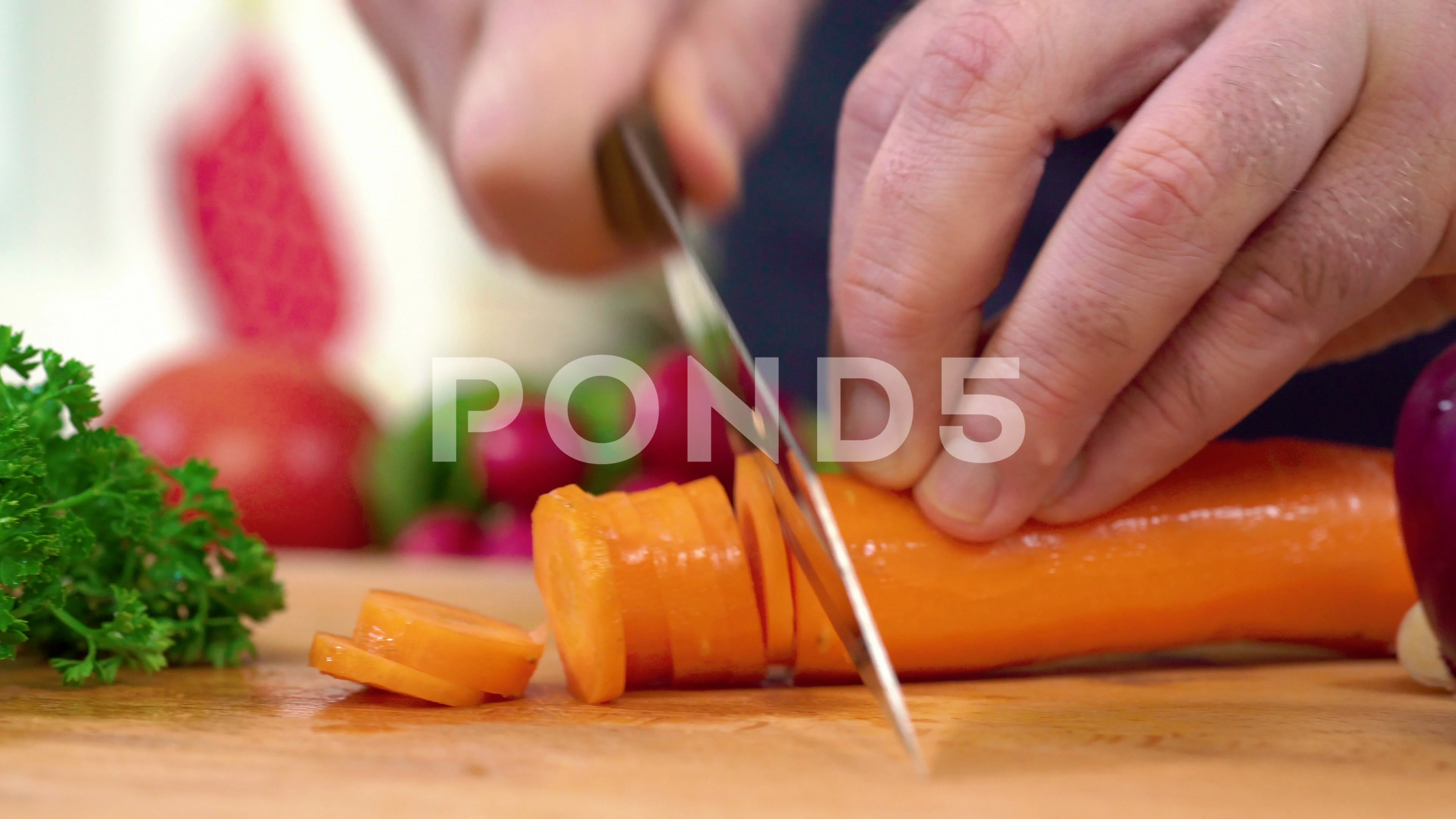 Chef chopping carrot sticks into a small dice, closeup shot. Man performing  good knife skills during cooking a meal Stock Photo - Alamy