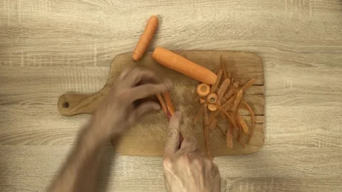 Chef slicing carrot with knife Stock Footage 122280079