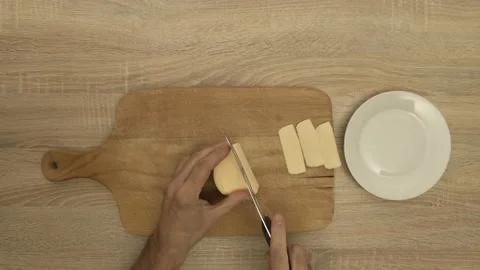 Chef slicing cheese with knife Stock Footage 121976453