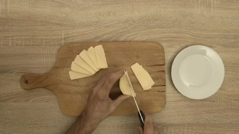 Chef slicing cheese with knife Stock Footage 121976586