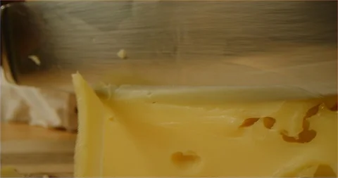 Chef slicing cheese macro shot Stock Footage 126295633