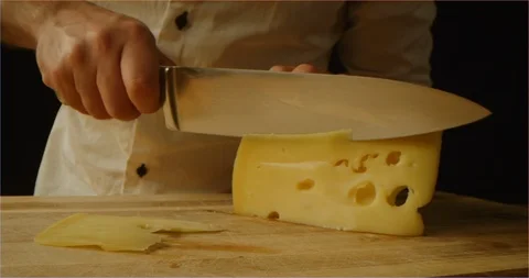 Chef slicing cheese macro shot Stock Footage 126295806