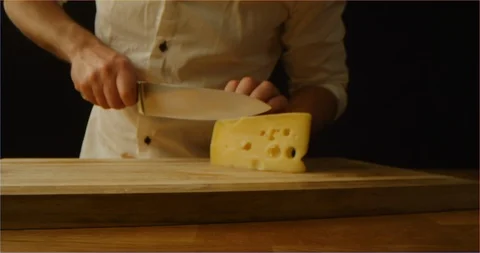 Chef slicing cheese macro shot Stock Footage 126295925