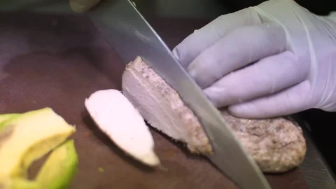 Chef slicing chicken breast Stock Footage 98239880