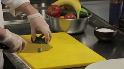 Chef slicing a cucumber finely, close up 스톡 동영상 66065063