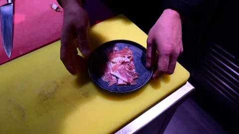 Chef slicing cured ham in a professional kitchen Video stock 327580281