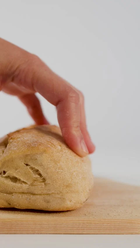 Chef Slicing Fresh Bread Bun on Wooden Cutting Board Stock Footage 337394801