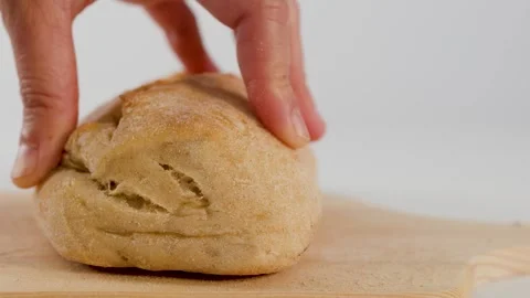 Chef Slicing Fresh Bread Bun on Wooden Cutting Board Stock Footage 337533099