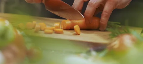Chef slicing a fresh carrot Stock Footage 311834914