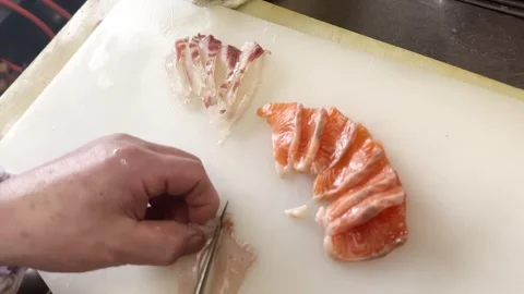 Chef slicing fresh olive flounder for sashimi with salmon, top view Stock Footage 339382074