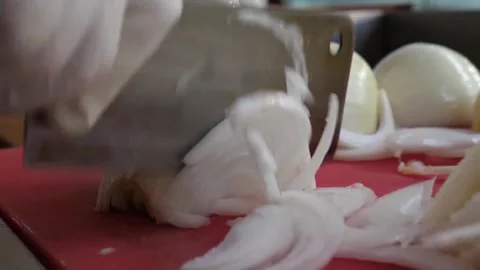 Chef Slicing Fresh Onion on Cutting Board in Commercial Kitchen Video stock 343587919