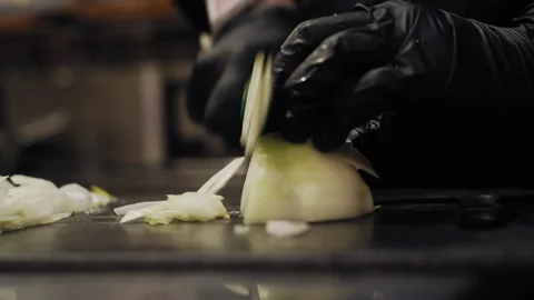 Chef Slicing Fresh Onion on Kitchen Cutting Board Video stock 307089029