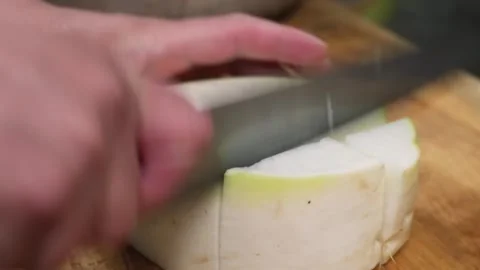 Chef Slicing Fresh Raw Kohlrabi Bulb on Wooden Cutting Board, Close-up Stock Footage 333573275