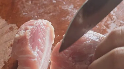Chef Slicing Fresh Raw Pork Meat on Wooden Cutting Board Video stock 337616350