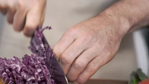 Chef slicing fresh red cabbage for salad Stock-Footage 92221309