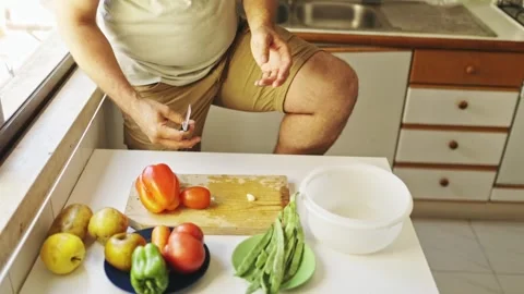 Chef slicing garlic with knife on cutting board Stock Footage 307959591
