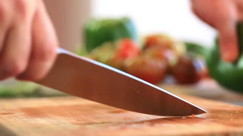 Chef slicing green pepper with a big knife Stock Footage 232926895