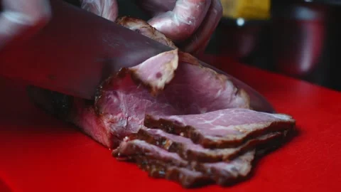 Chef Slicing Juicy Meat with Sharp Knife, Slow Motion Stock Footage 339772361