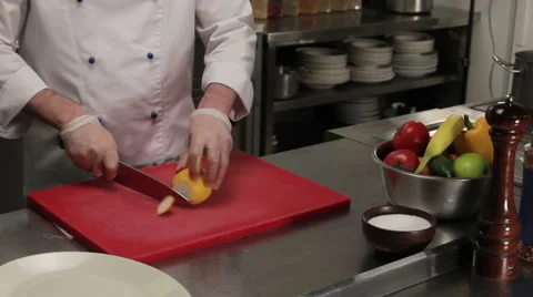 Chef slicing lemon, medium shot Stock Footage 66061403