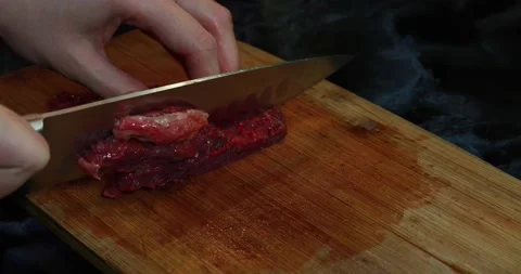 Chef slicing meat 스톡 동영상 147141593