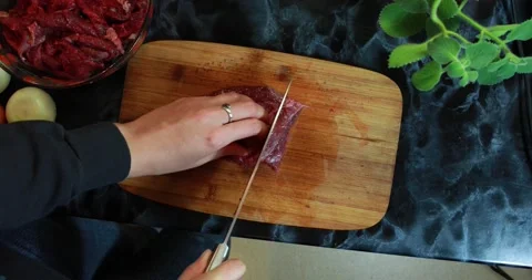 Chef slicing meat Stockbeeldmateriaal 147141738