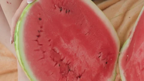 Chef slicing melon, Home cook cuts ripe watermelon for refreshing salad, Casual Stock Footage 329498227