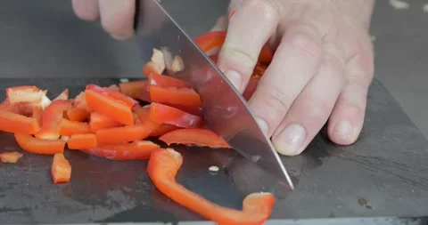 Chef slicing paprika on plate Stock-Footage 243765950
