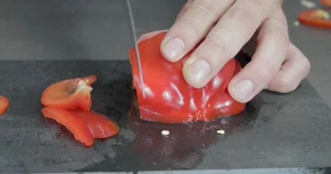 Chef slicing paprika on plate Stock-Footage 243765951