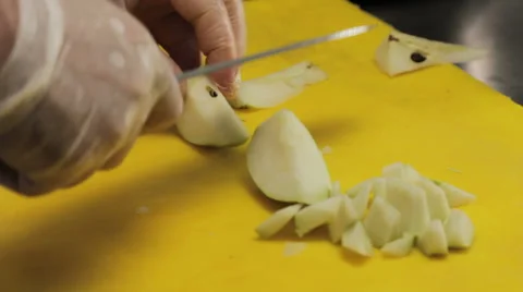 Chef slicing a peer, close up Stock Footage 66058366