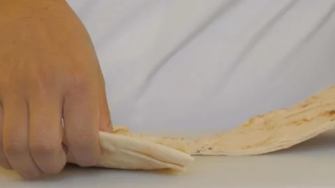 Chef slicing pita close-up. Preparing traditional Turkish bread for holy month Stock Footage 172265478