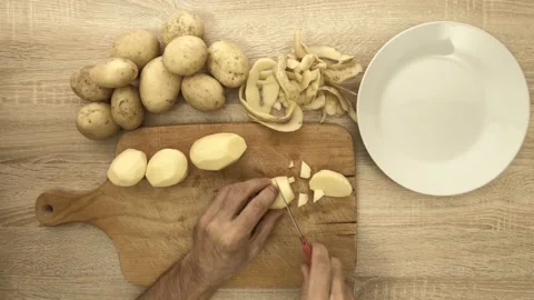 Chef slicing potato with knife Stock Footage 121977624