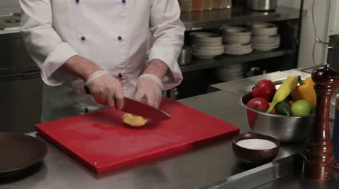 Chef slicing a potato, medium shot 動画素材 66060460