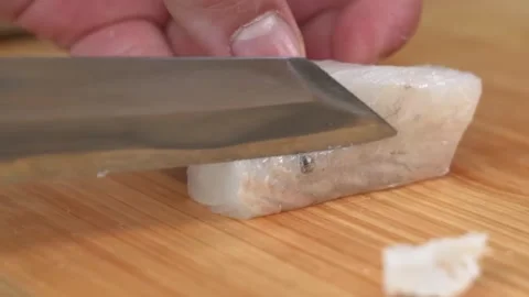 Chef Slicing Raw White Fish Fillet for Sashimi with Sharp Japanese Knife Stock Footage 333600536