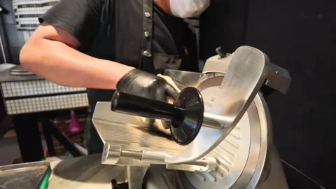 Chef Slicing Roast Beef with Electric Deli Slicer in Commercial Kitchen Stock Footage 338321380