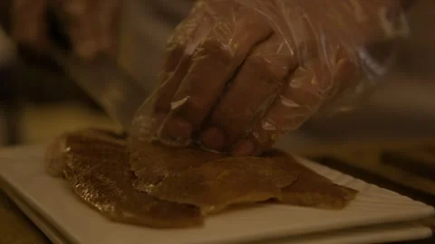 Chef Slicing Roasted Meat for Serving in Beijing Restaurant Kitchen Close Up Stock Footage 345785742