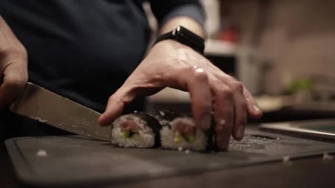 Chef Slicing Salmon and Preparing Sushi Rolls with Cheese and Cucumber. 스톡 동영상 307116434