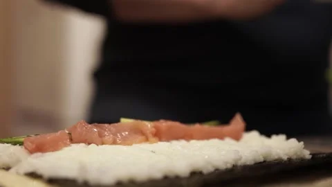 Chef Slicing Salmon and Preparing Sushi Rolls with Cheese and Cucumber. 스톡 동영상 307123653