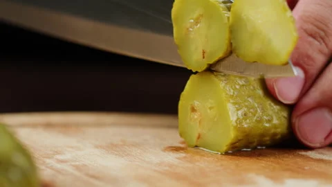 Chef slicing Salted pickles with knife from jar can, Cucumbers preservations Stock Footage 261599672